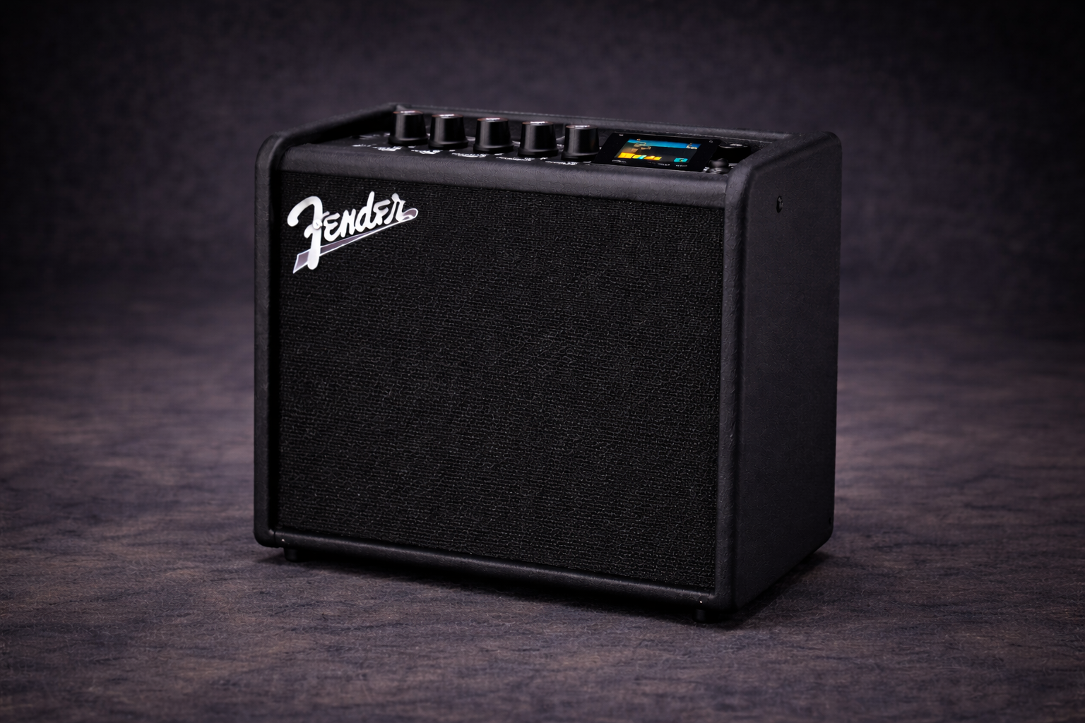 Three-quarter view of a Fender Mustang LT25 guitar amplifier on a dark textured surface with a subtle studio background