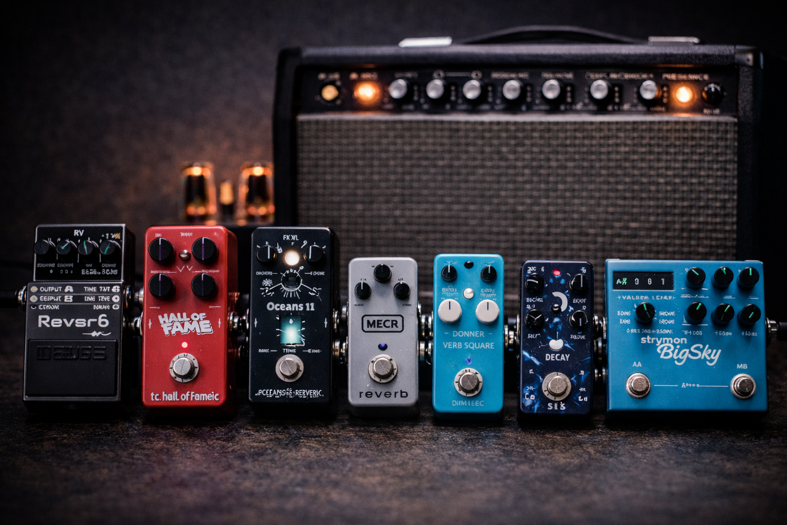 Best reverb pedal for guitar comparison, seven reverb pedals lined up in front of a small tube amp
