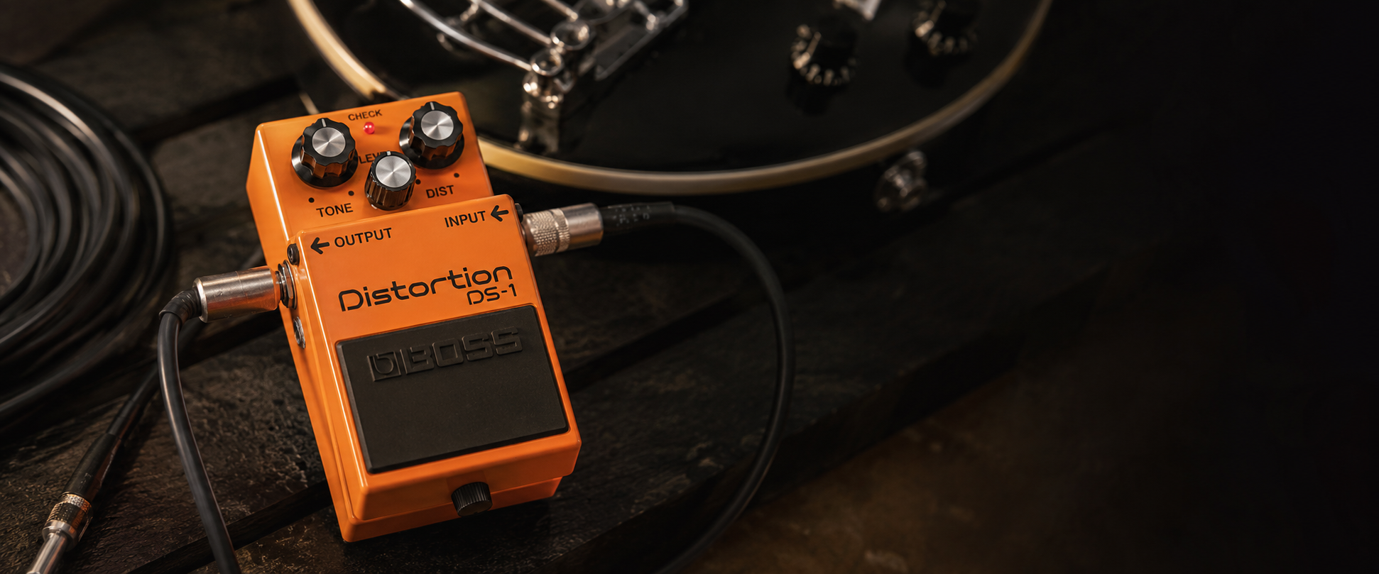 Boss DS-1 review orange distortion pedal on a pedalboard